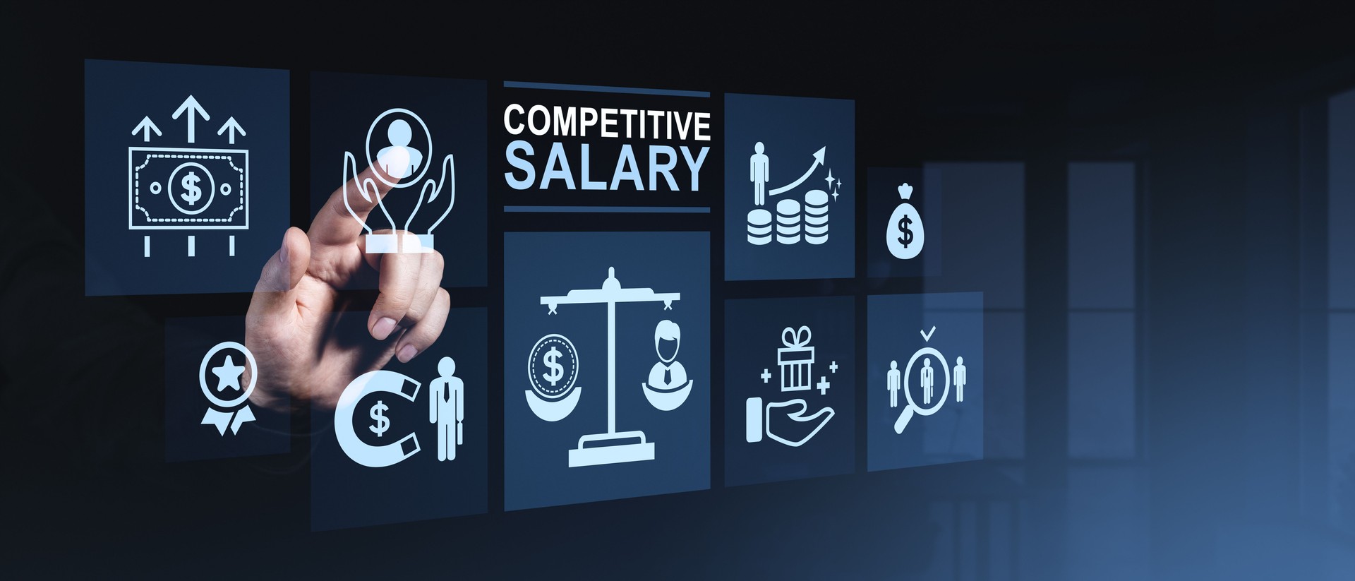 Hand interacting with digital interface displaying competitive salary icons and financial growth concepts in modern business environment on dark blue background.