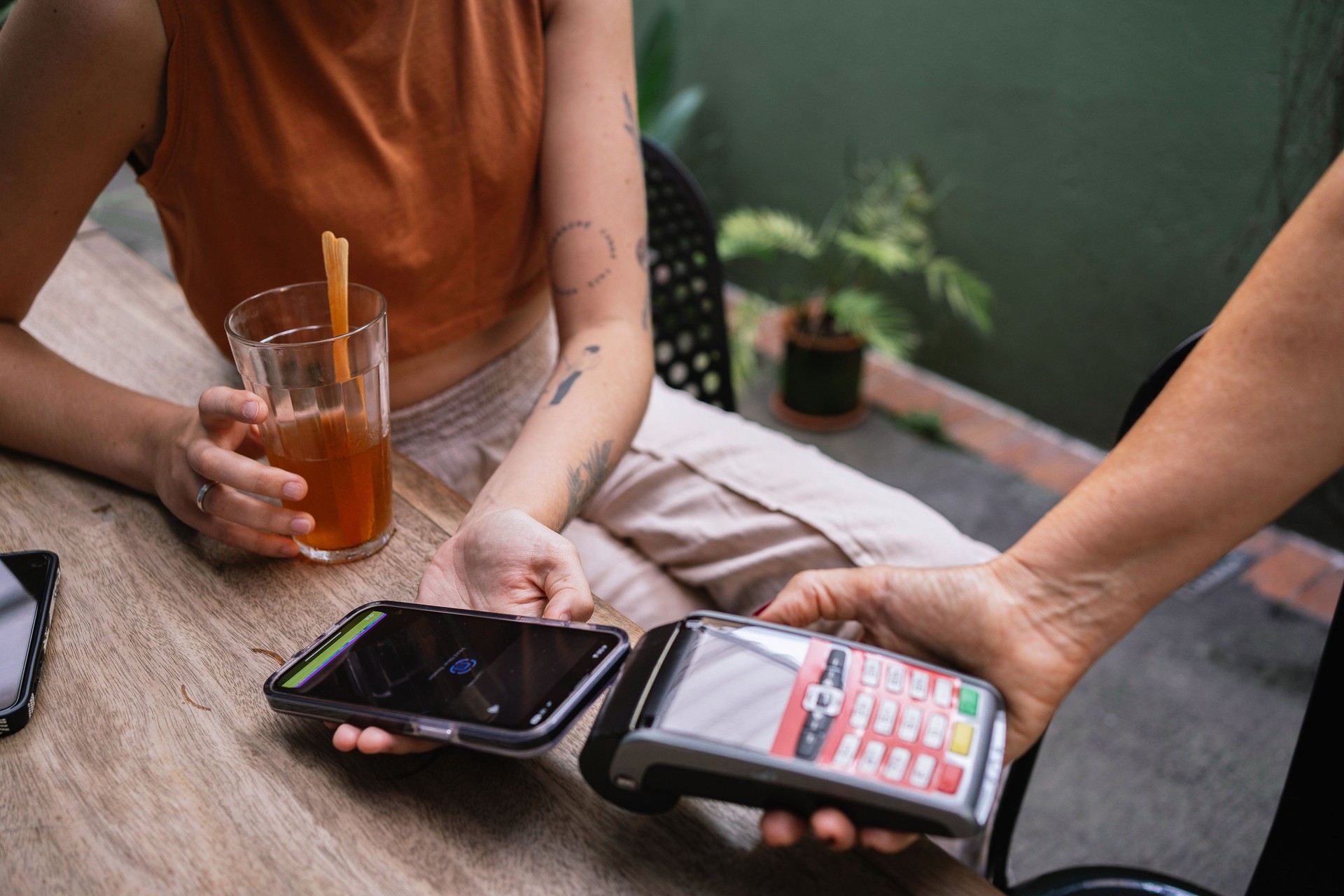 Young woman making payment with mobile